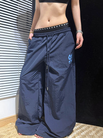 Brick Lane Layered-Look Star Graphic Baggy Sweatpants - Navy Blue